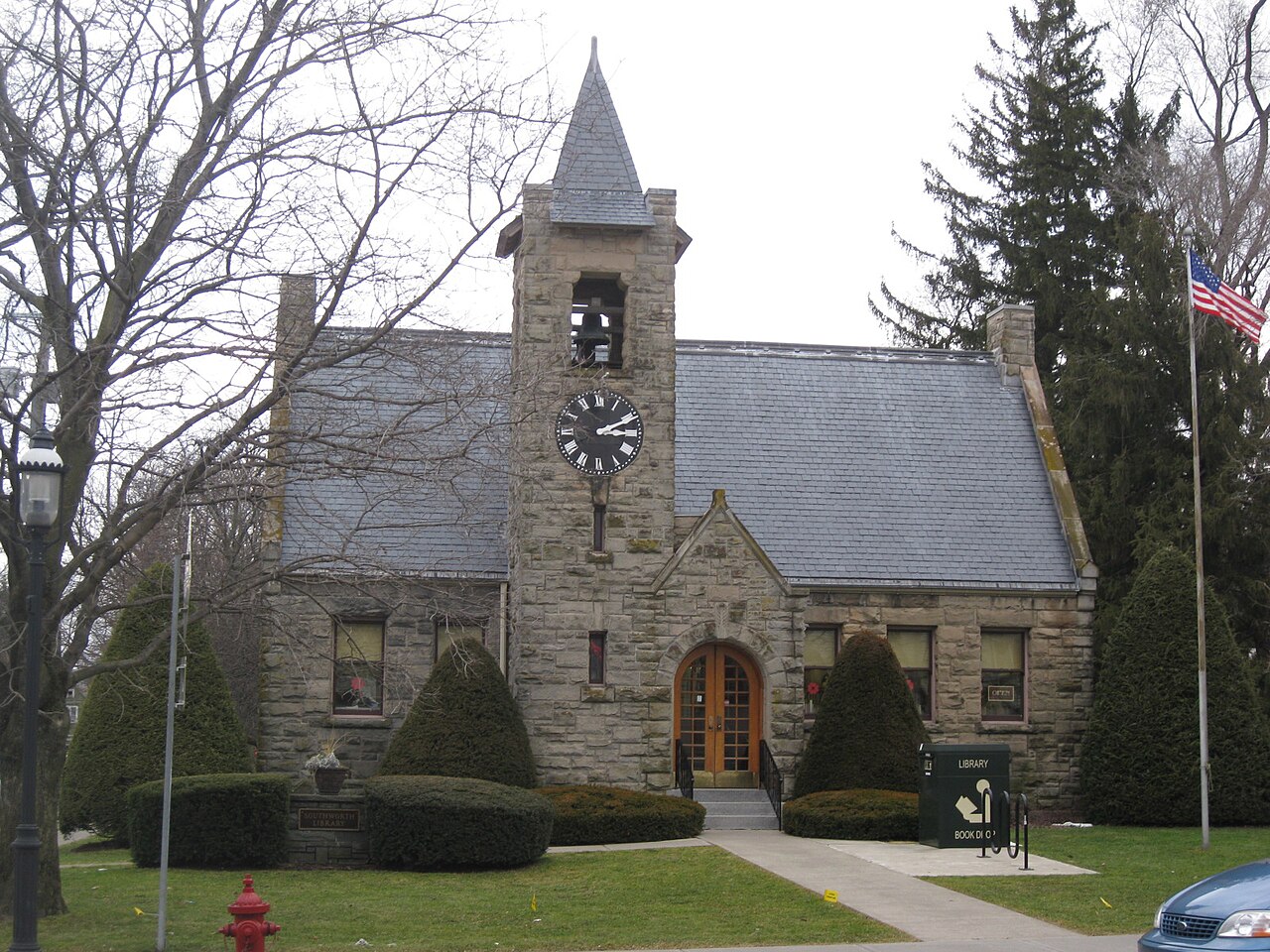 The stone Southworth Library with its clock tower in the village of Dryden, New York.