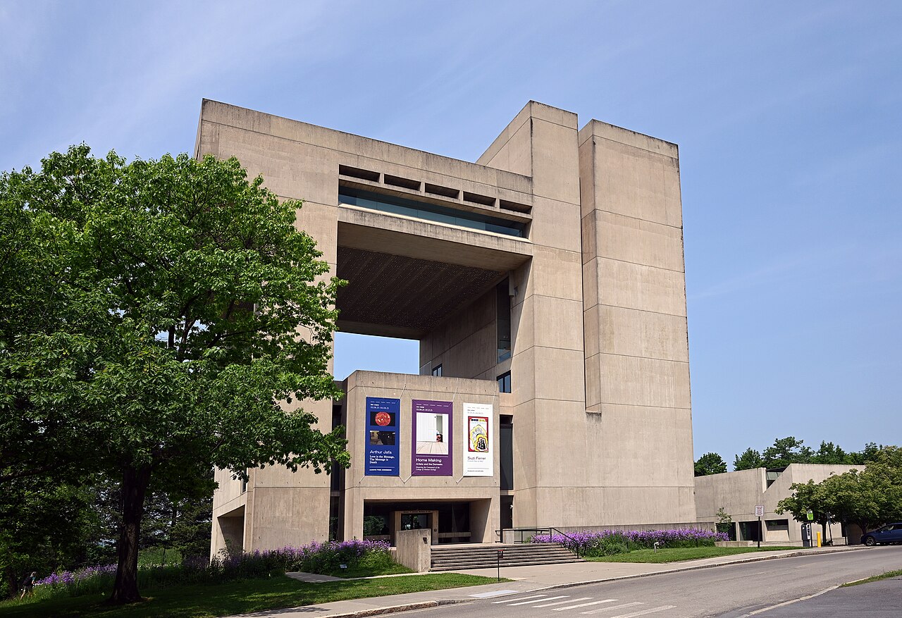 The concrete I.M. Pei-designed Herbert F. Johnson Museum of Art at Cornell University under a blue sky.